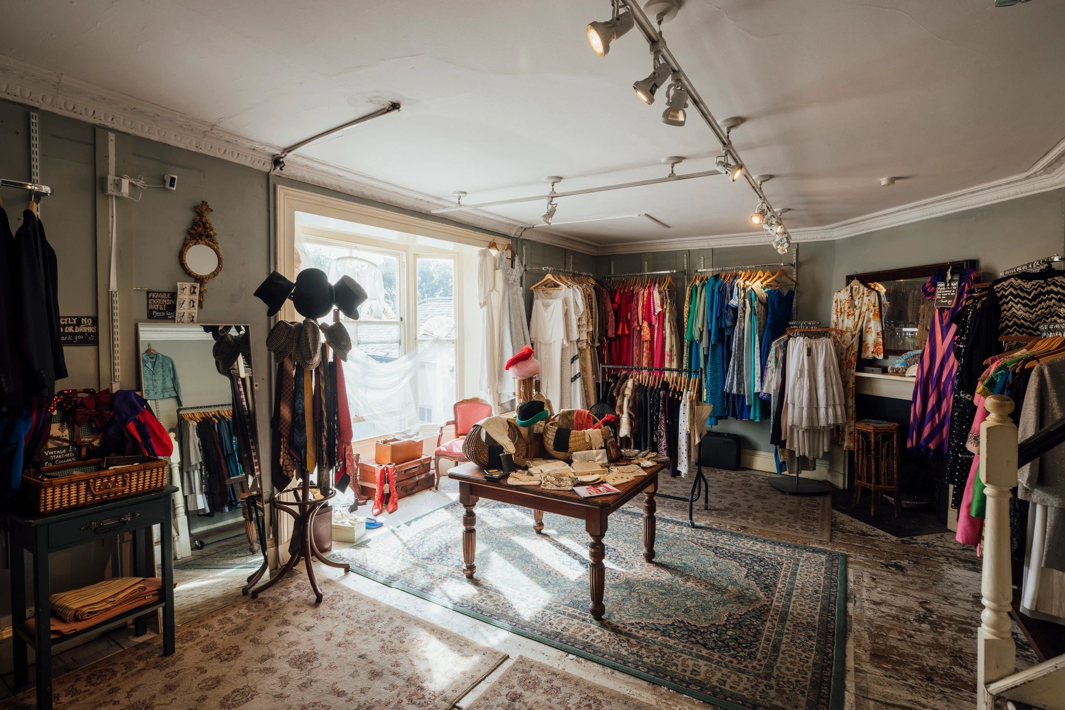 Monochrome boutique interior with garments and accessories
