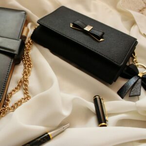 Minimal monochrome bag on textile backdrop