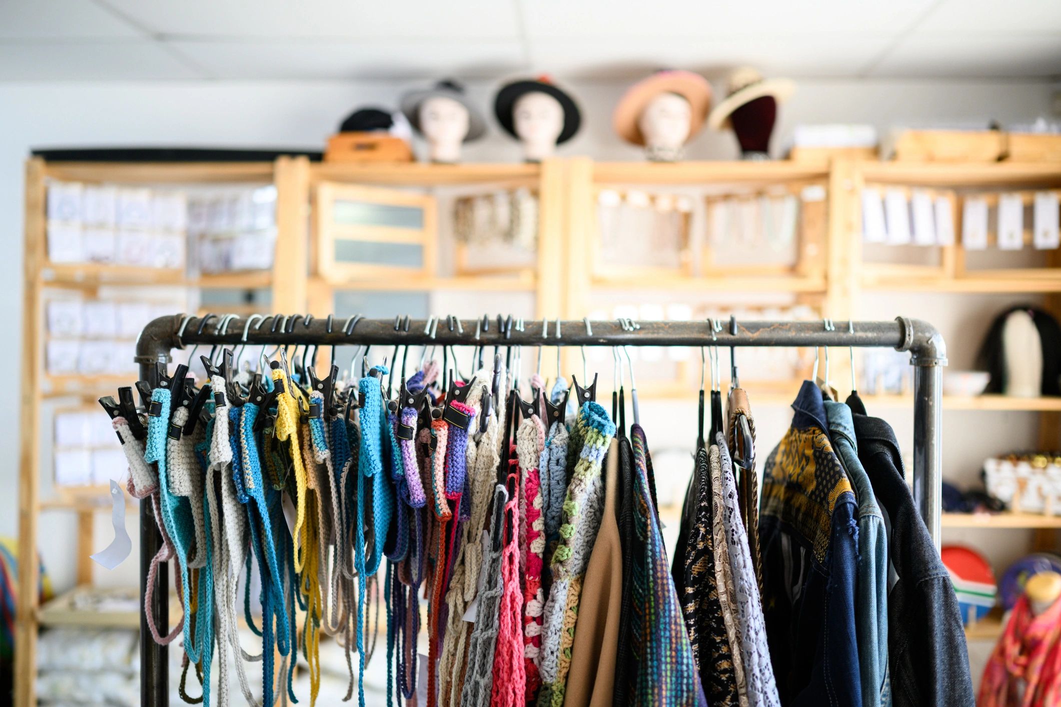 Minimal boutique interior with garments on a rack, representing the shopping experience