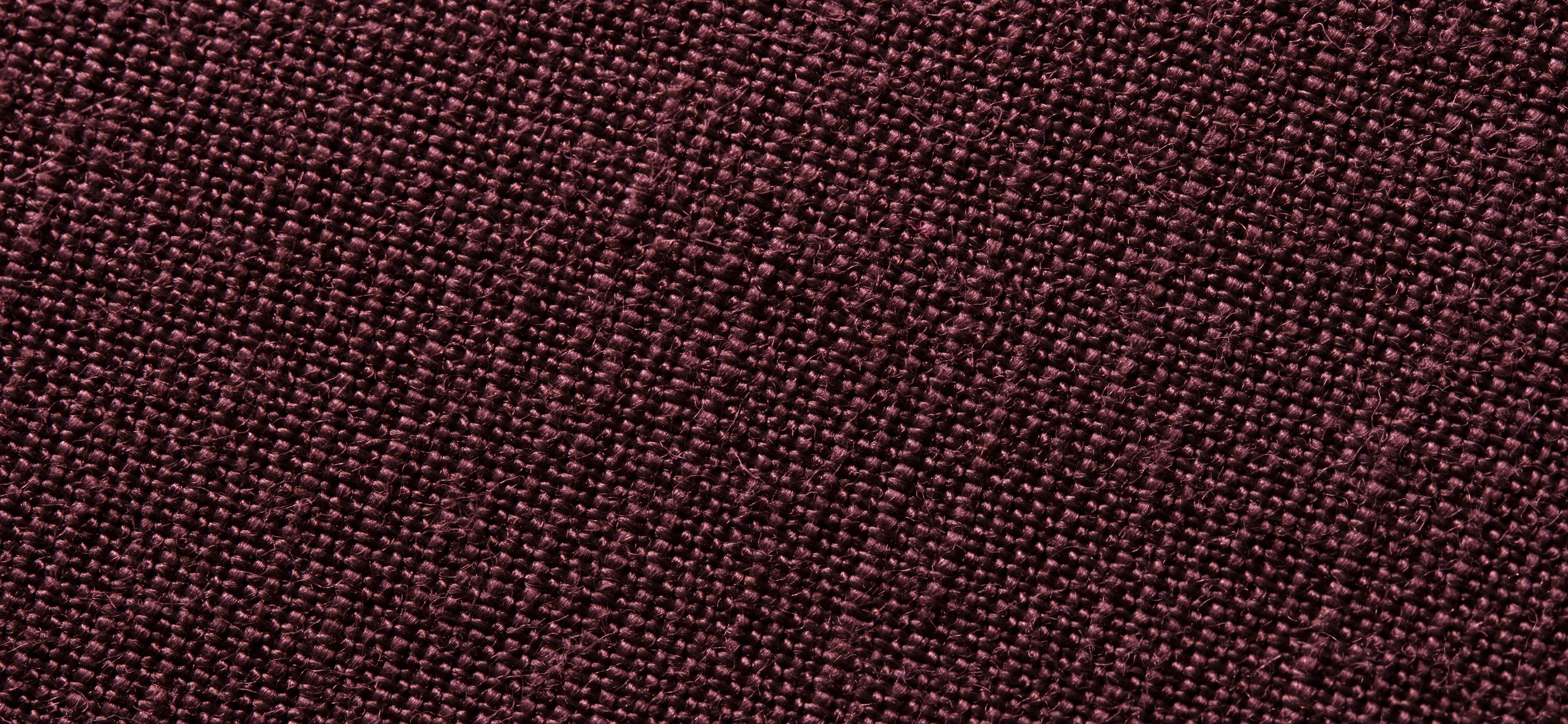 Dark woven fabric texture close up